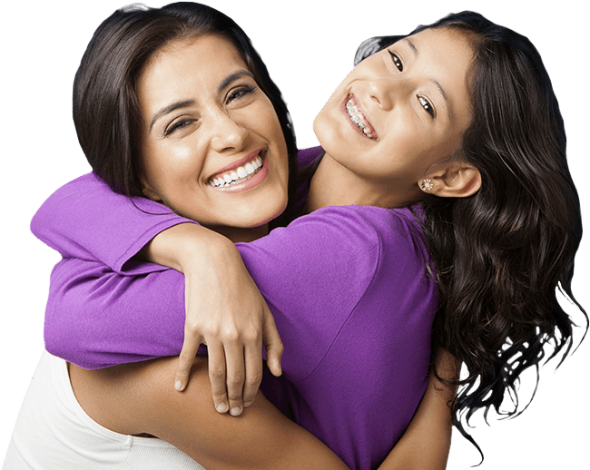 Smiling mother and daughter hugging