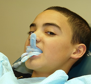 Child receiving fluoride treatment