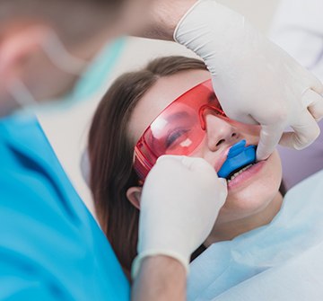 Clinton pediatric dentist applying fluoride treatment