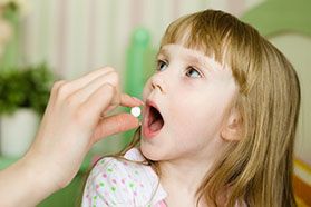 a child being given an oral sedative 