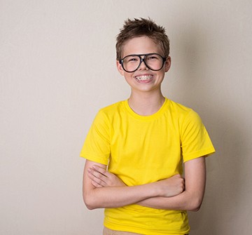 Young boy smiling after Phase 1 Orthodontics in Clinton 