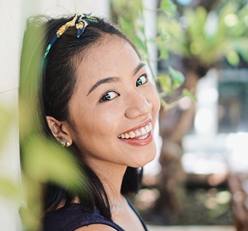 Young woman with tooth colored fillings smiling