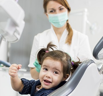 Little girl smiling after dental sealant application